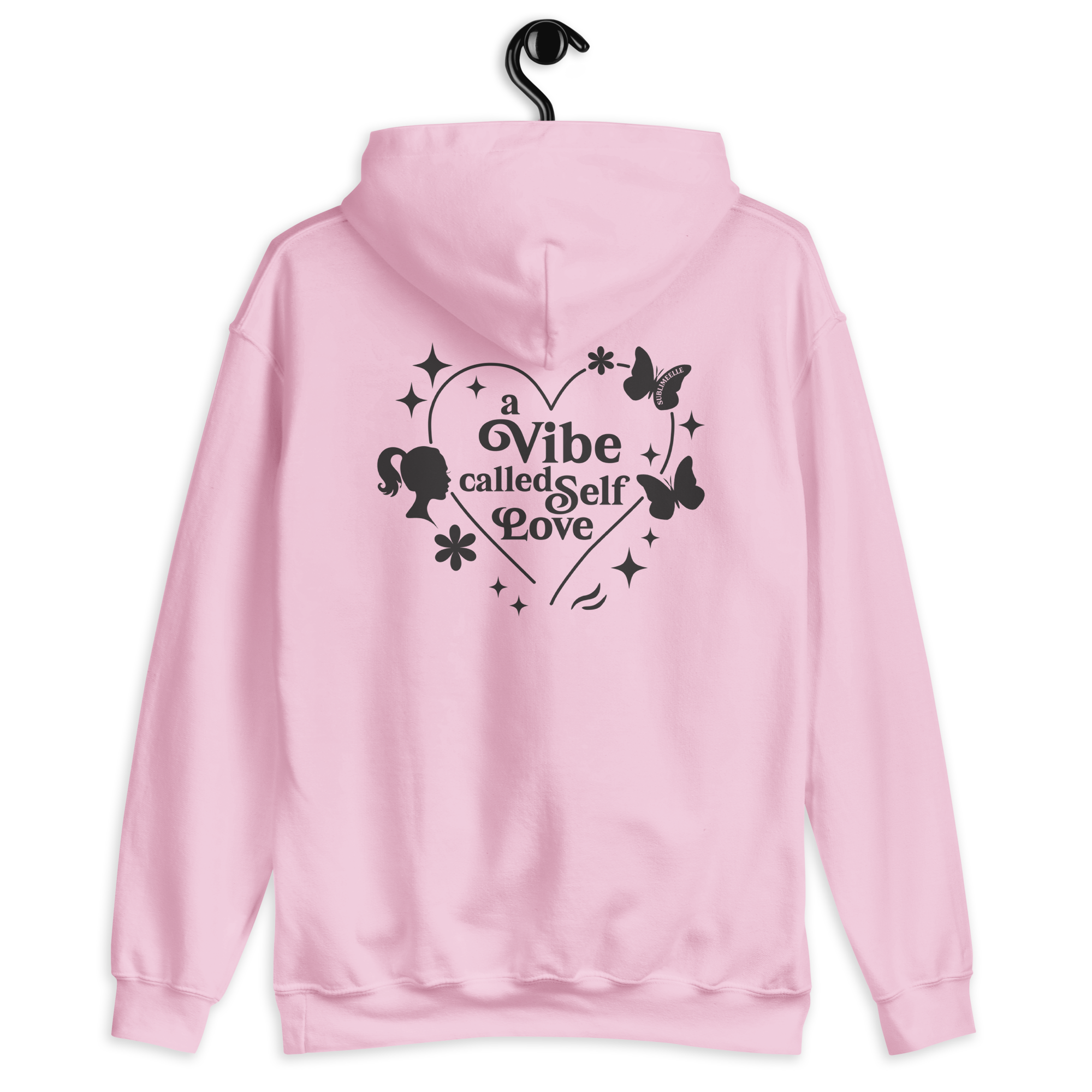 Pastel pink hoodie shown from the back with a design and printed text ‘a vibe called self-love’. Cozy self care and self love sweatshirt for confidence, healing and personal growth.