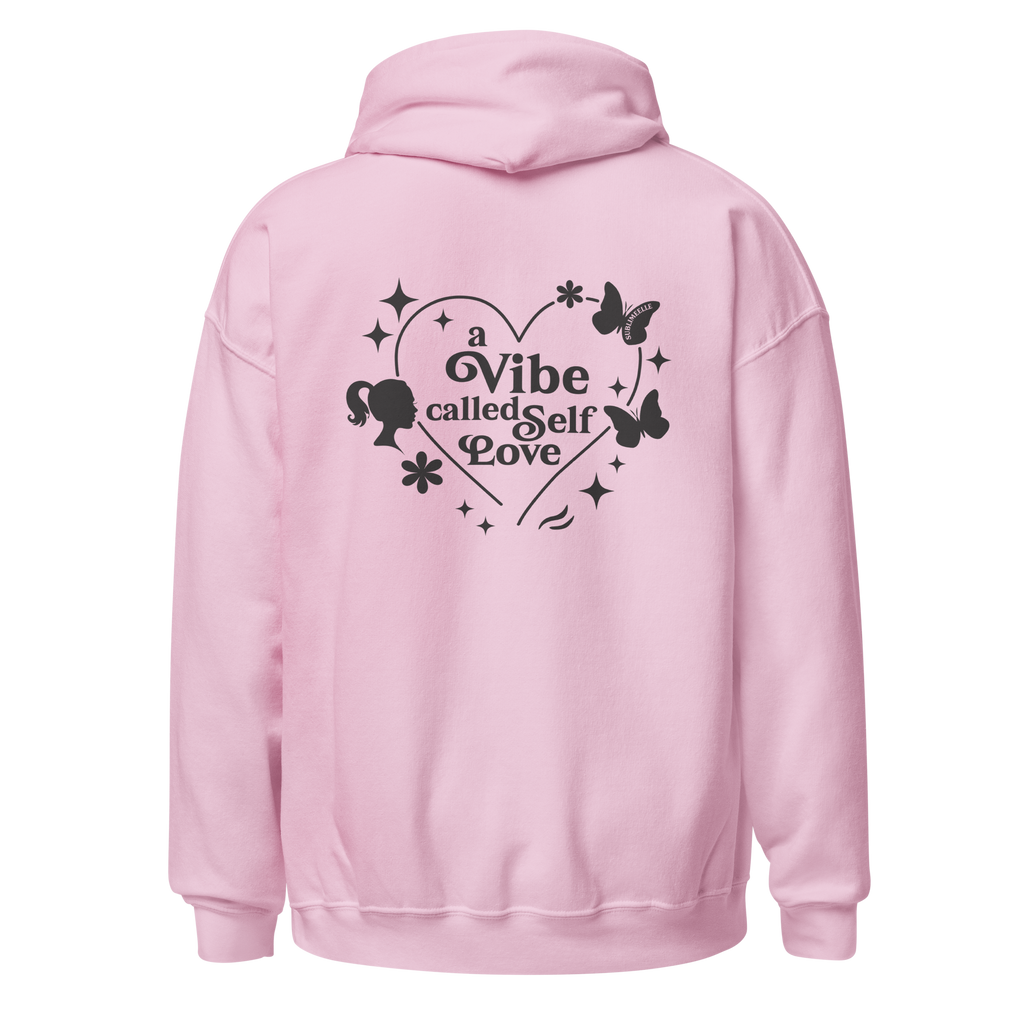 Light pink SublimeElle Self-Love hoodie with a design and the quote ‘A vibe called self-love' in black lettering, back view.