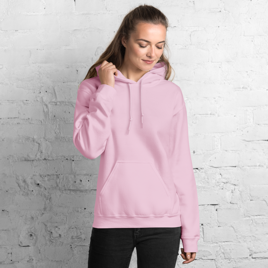 Woman wearing light pink SublimeElle Self-Love hoodie with quote 'a vibe called self-love' in black, casual outdoor setting, front view.